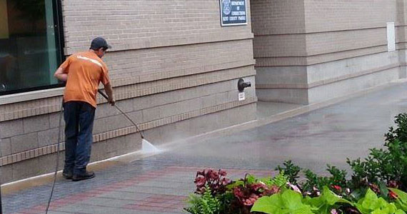 A Pro Cleaner Cleaning a Storefront