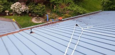 A House Undergoing Roof Cleaning 